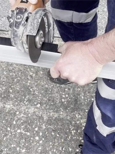 Garage Door Seal Installation Cut with Grinder